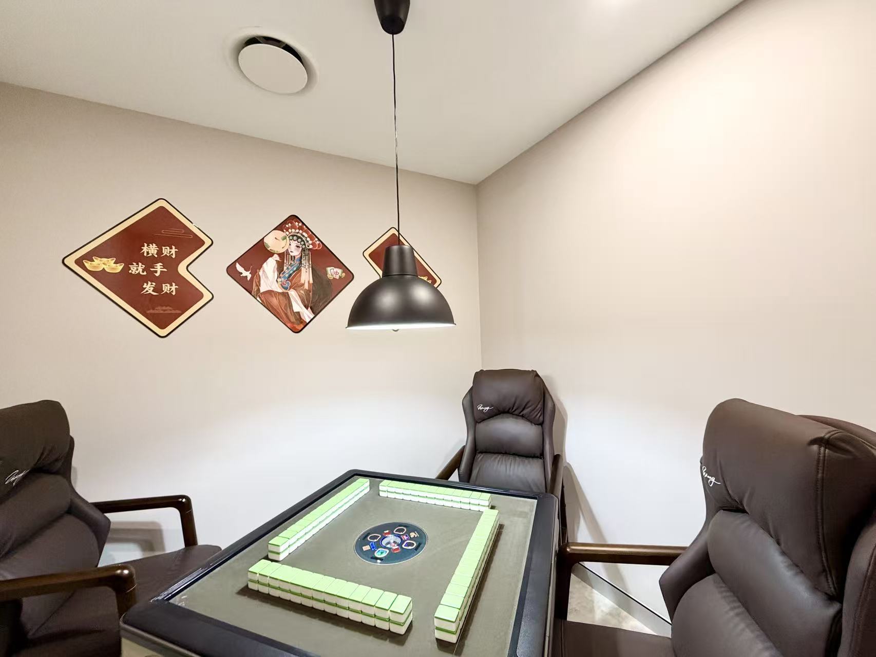 Close-up of the automatic mahjong table and the tile walls stacked around it